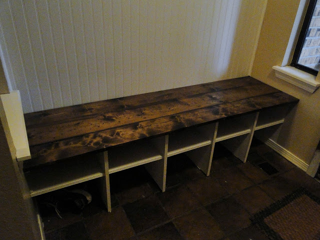 DIY bench with cubbies below for hats, gloves, and shoes