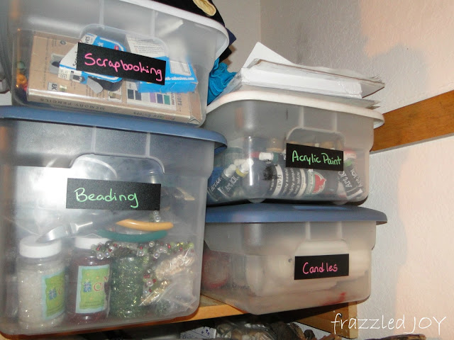 craft supplies organized in plastic tubs