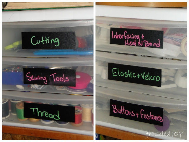 sewing notions organized in small plastic drawers