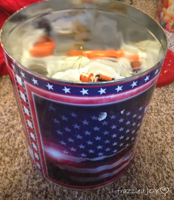 Inexpensive ornament storage using old popcorn tins