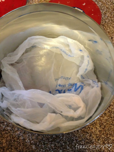 Storing ornaments in old popcorn tins