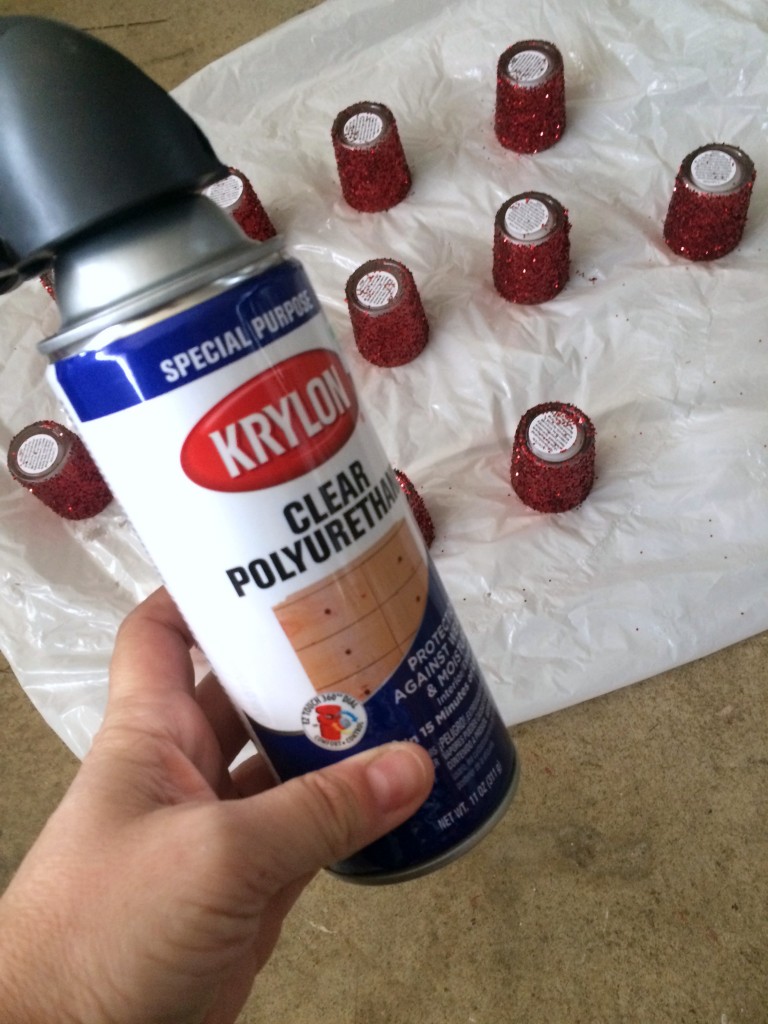 A coat of spray poly may help hold the glitter in place.