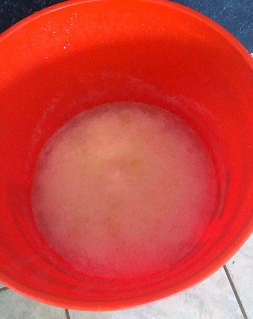 homemade laundry detergent mixed in a 5-gallon bucket