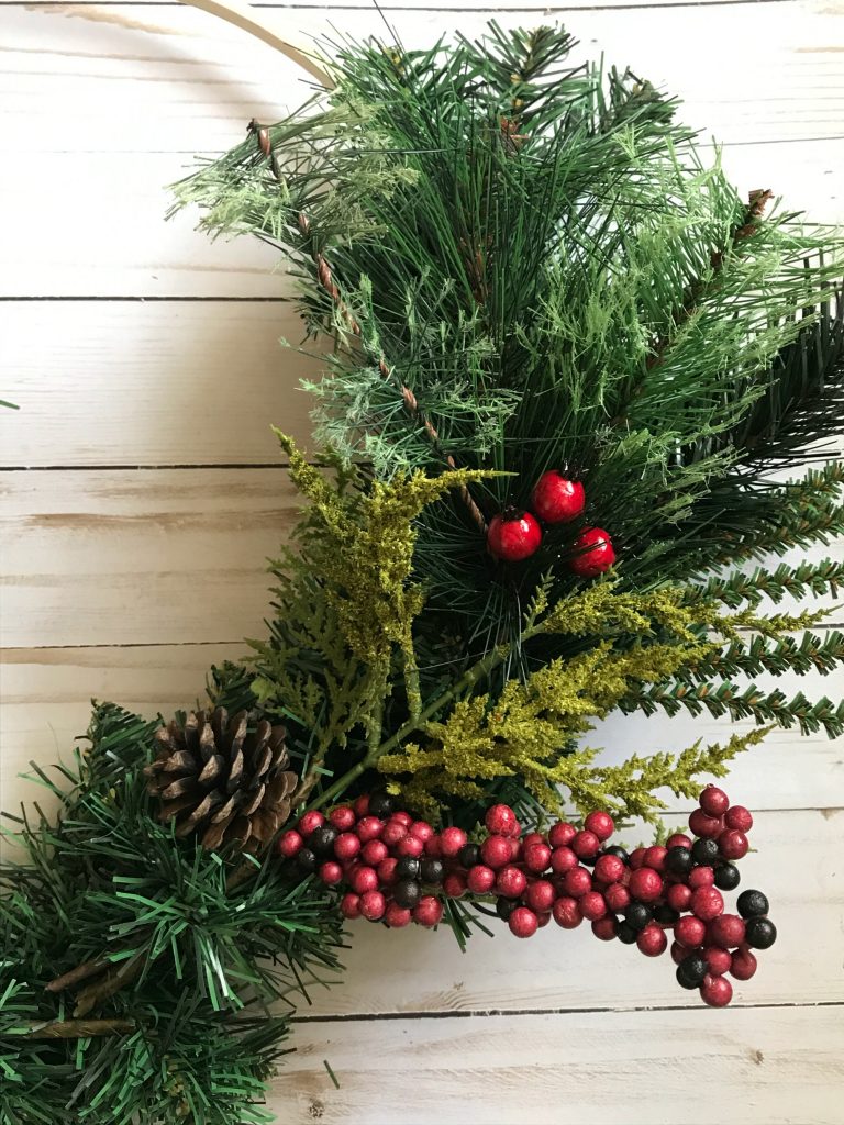 Add greenery picks to fill out your wreath