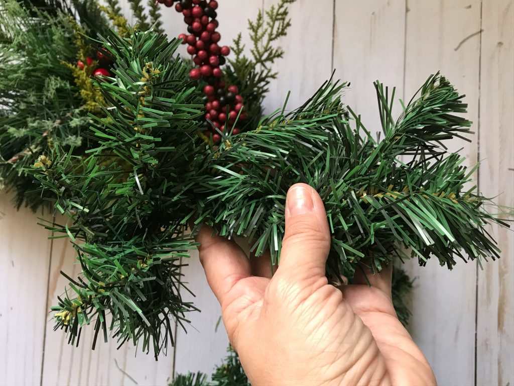 Use another piece of garland to cover up the wires from the greenery picks.