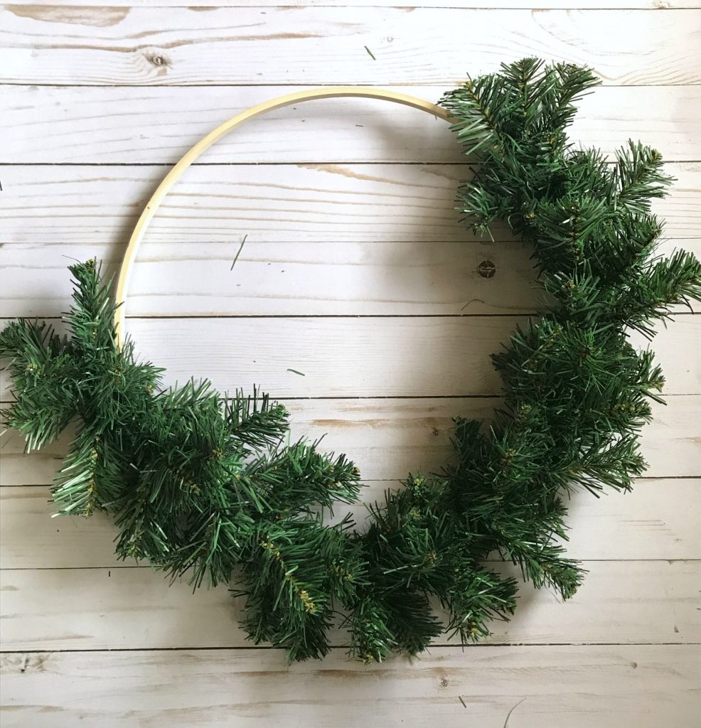 Use greenery garland as a base for your hoop wreath