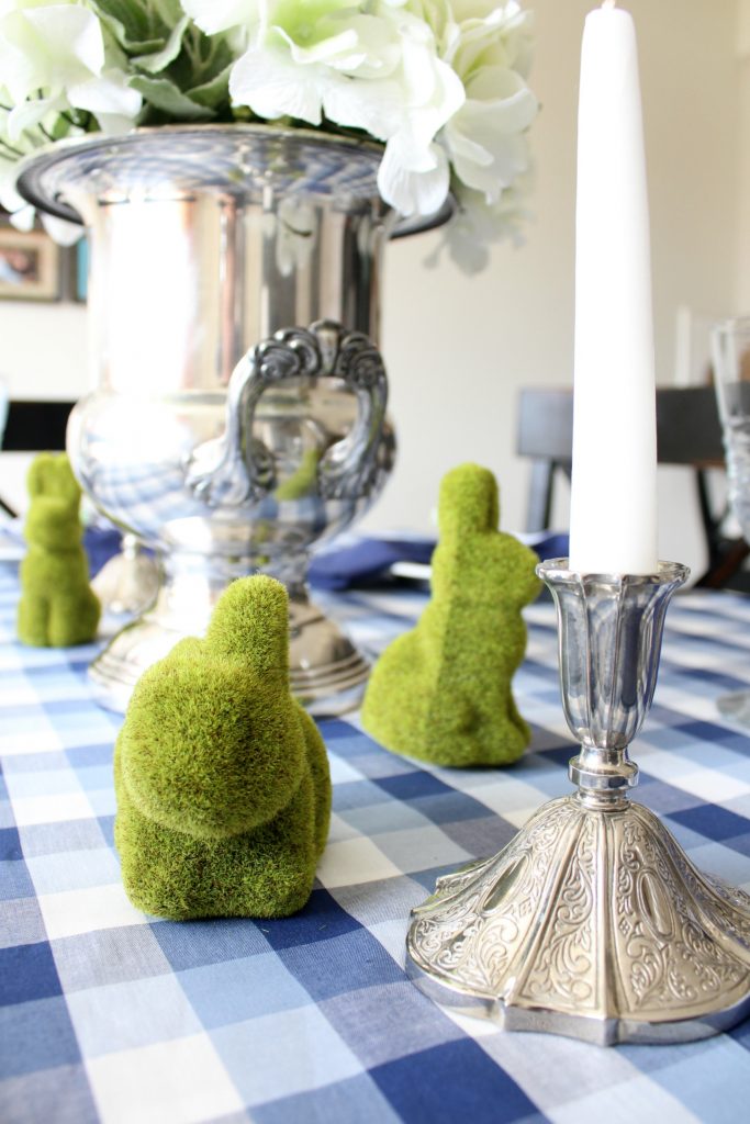 A silver, white and green centerpiece looks greats with the blue and white gingham tablecloth.