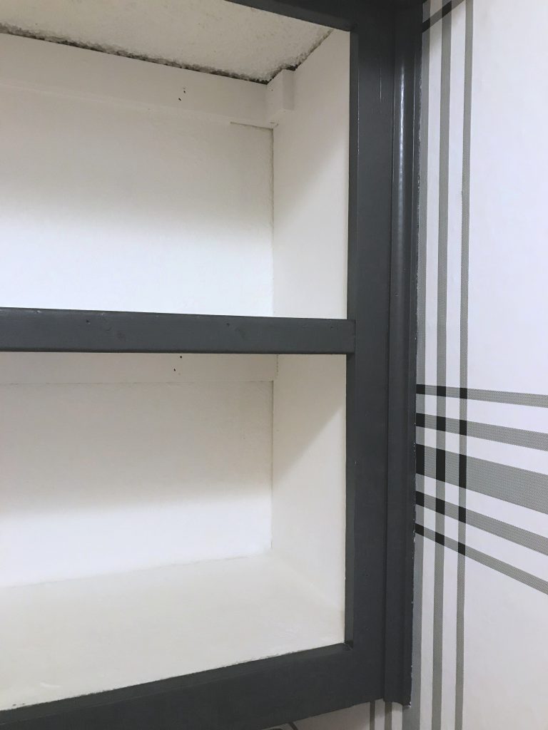 A simple piece of 1X2 made these cabinet look more like built-in shelves