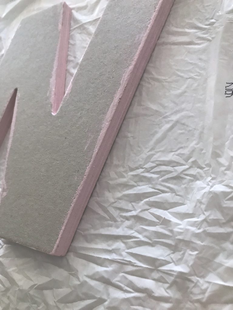 Paint edges of chipboard letters to coordinate with paper