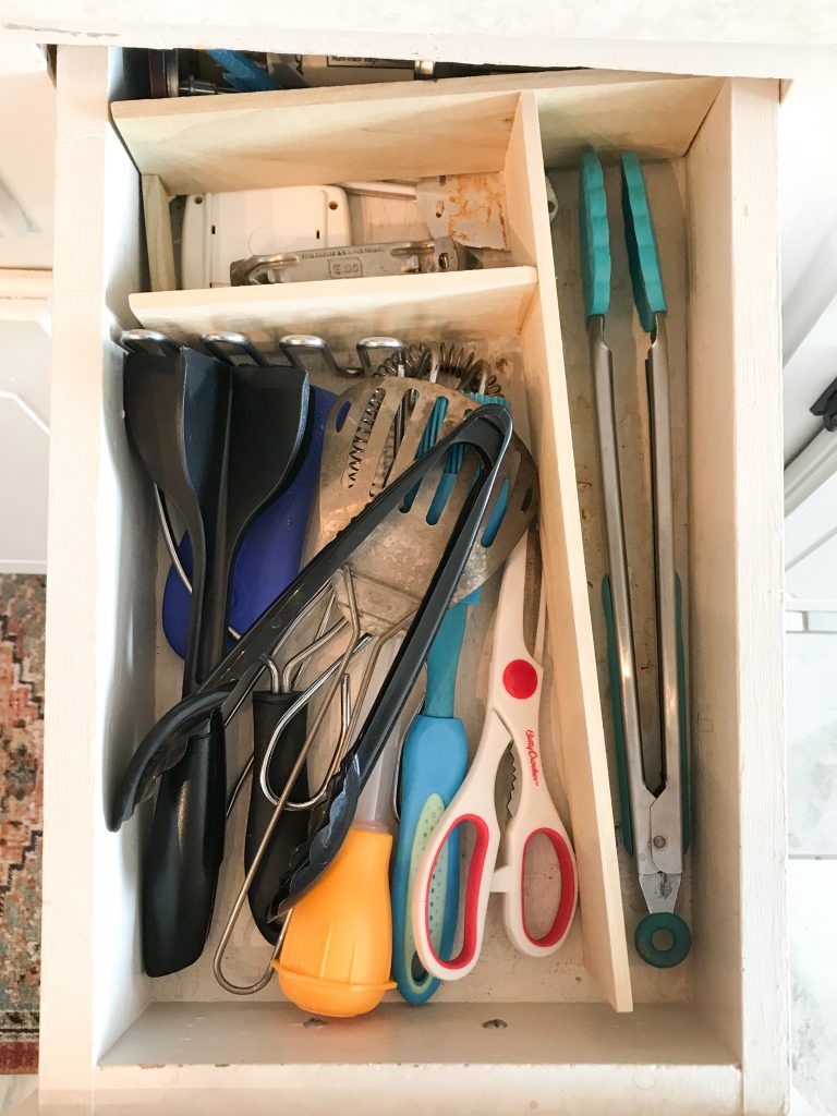 Disorganized kitchen utensil drawer