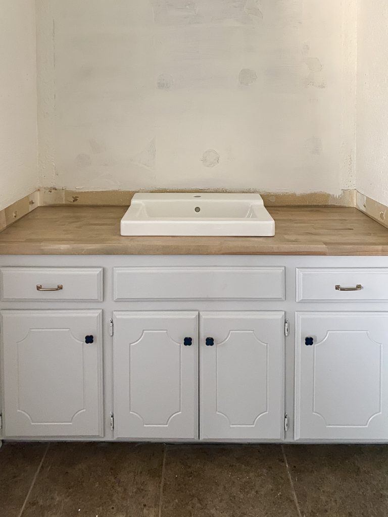 Butcher block counter and white sink