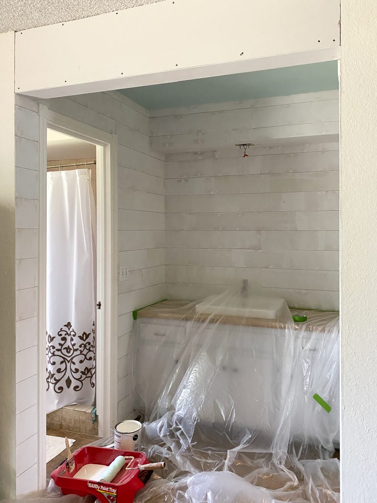 Shiplap installed in master bathroom